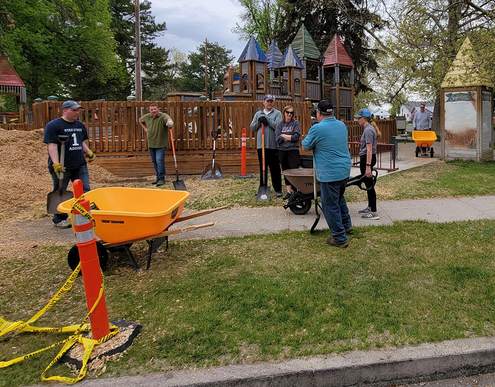 Lions Club members volunteering at a local playground